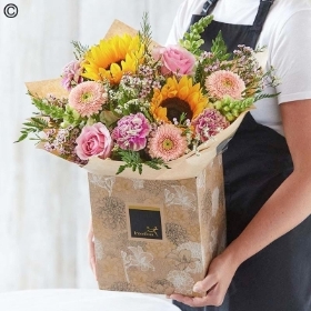 luxury Lily Free Hand tied bouquet made with seasonal flowers